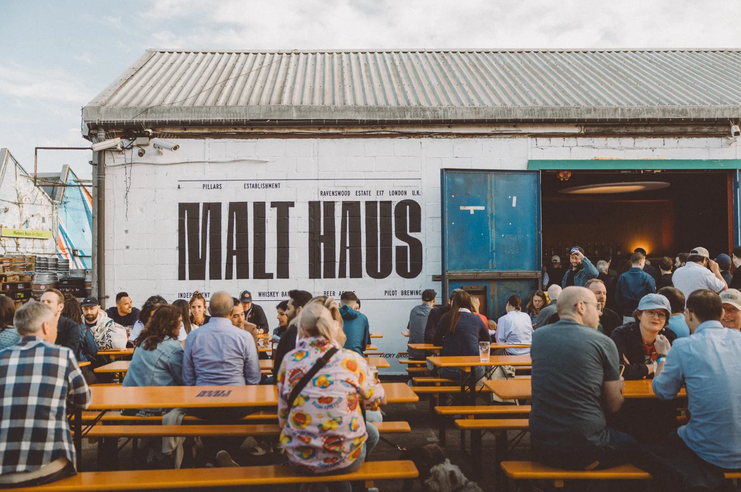 Customers seated outside the Malt Haus at Pillars Brewery in Walthamstow