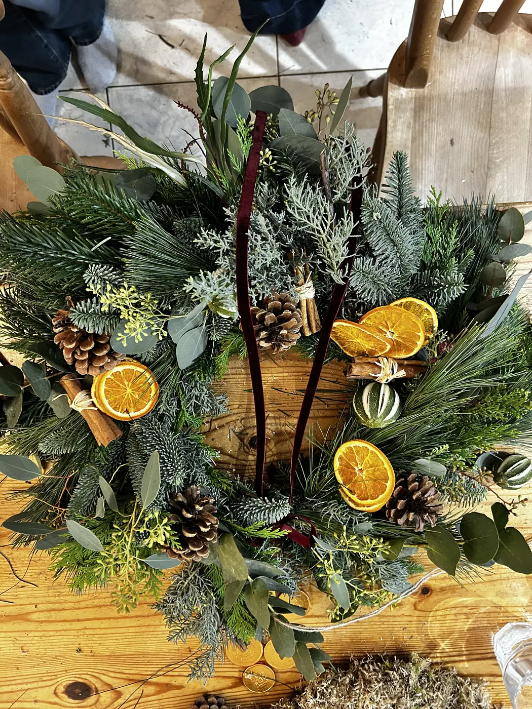 Natural Christmas wreath decorated with dried orange, eucalyptus and pine cones